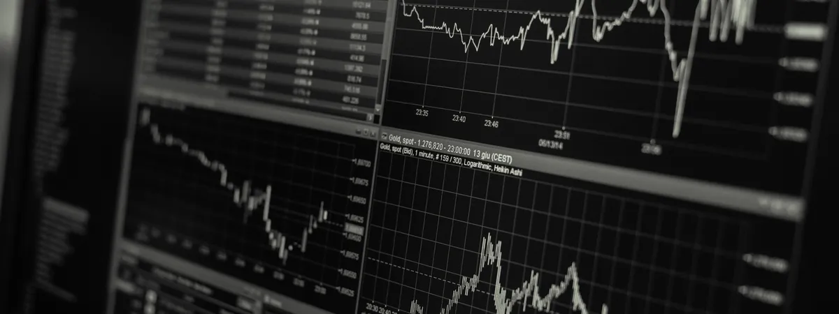 Trading screen with price charts on a dark monitor