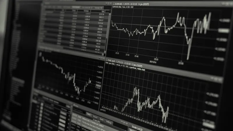 Trading screen with price charts on a dark monitor