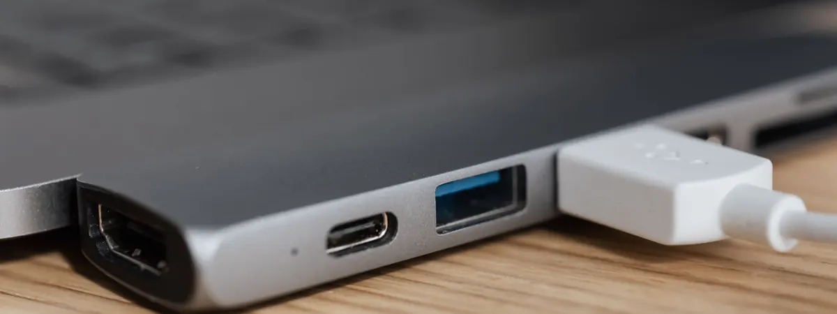 USB device plugged into a laptop, standing in for a hardware wallet