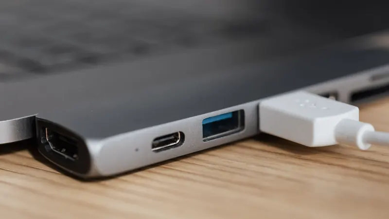 USB device plugged into a laptop, standing in for a hardware wallet